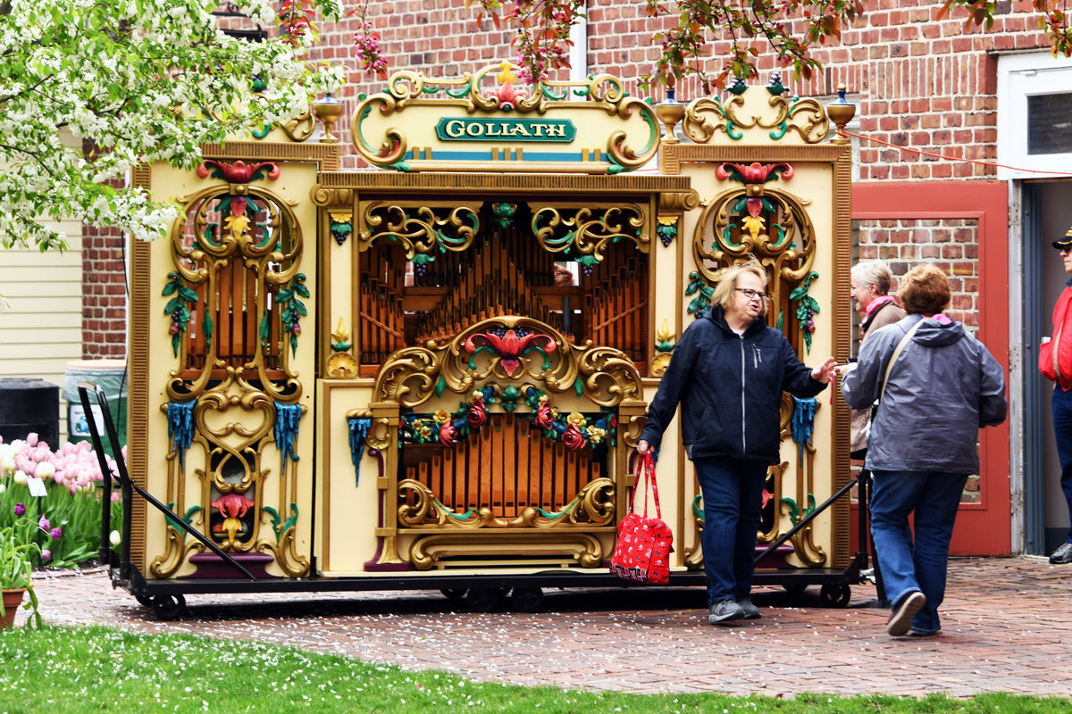 163 Deb Figgner in front of the ornate nickelodeon in the Pella Historical Village.JPG